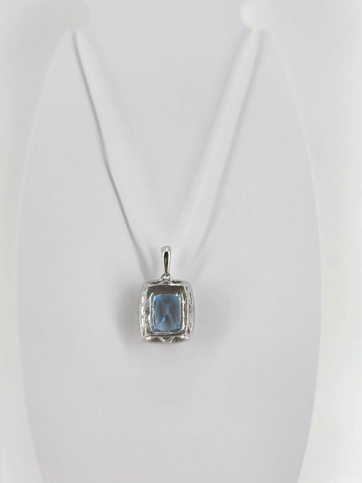 10K white gold blue topaz and diamond pendant  18334